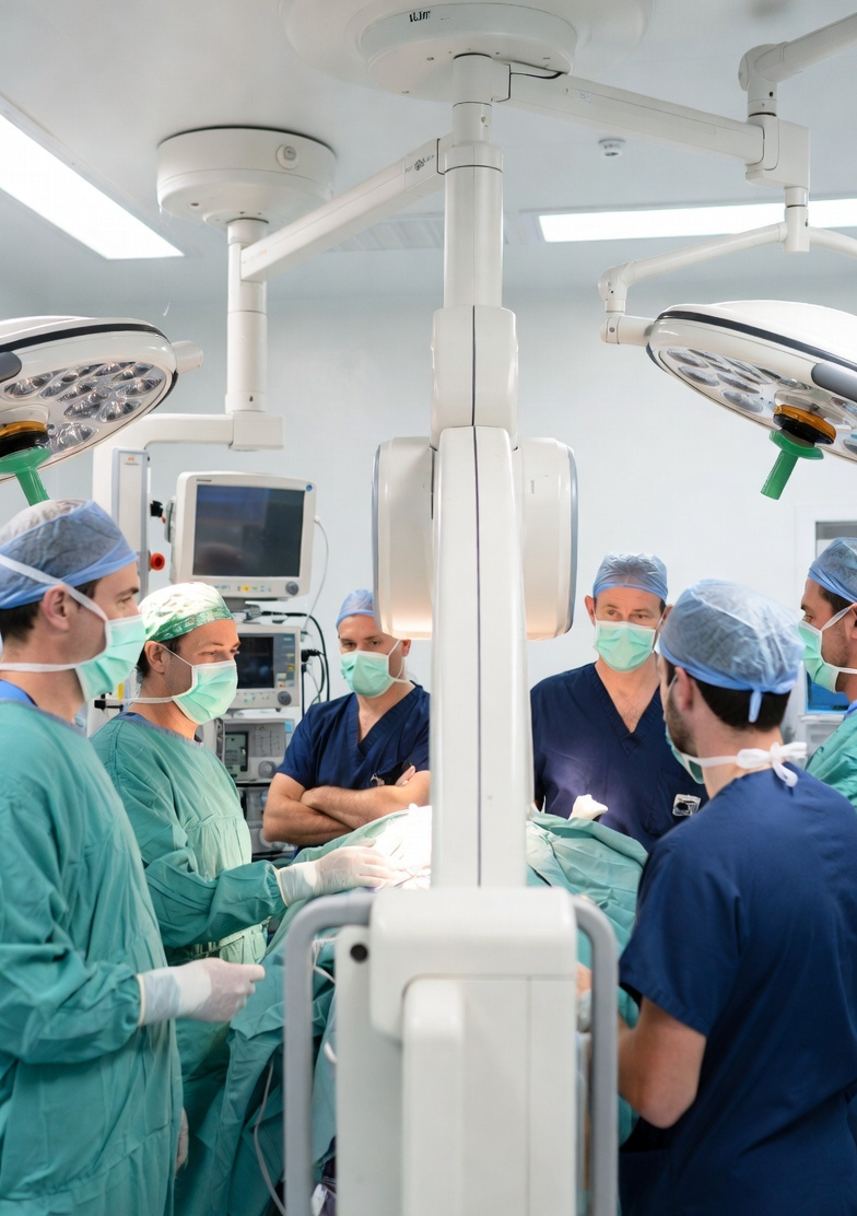 Surgical team in the operating theatre preparing for a cervical procedure